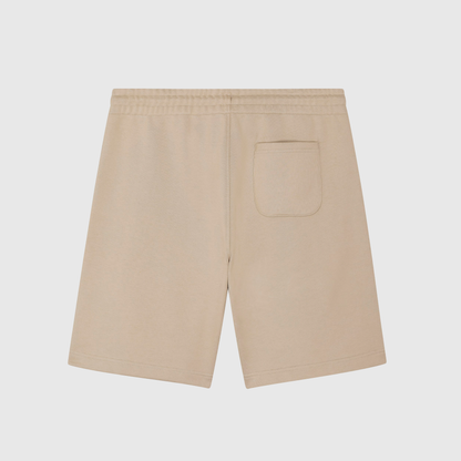 Beige joggingbroek met kenmerkende borduursels 
